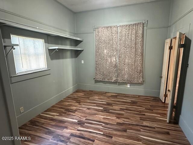 505 Fairview Ave, Abbeville, LA 70510 - laundry area featuring wood finished floors and baseboards