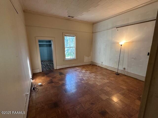 505 Fairview Ave, Abbeville, LA 70510 - unfurnished bedroom featuring ornamental molding and baseboards