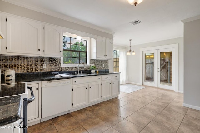 204 Eva Dr, Lafayette, LA 70508 - kitchen with a sink, crown molding, visible vents, decorative backsplash, and white dishwasher