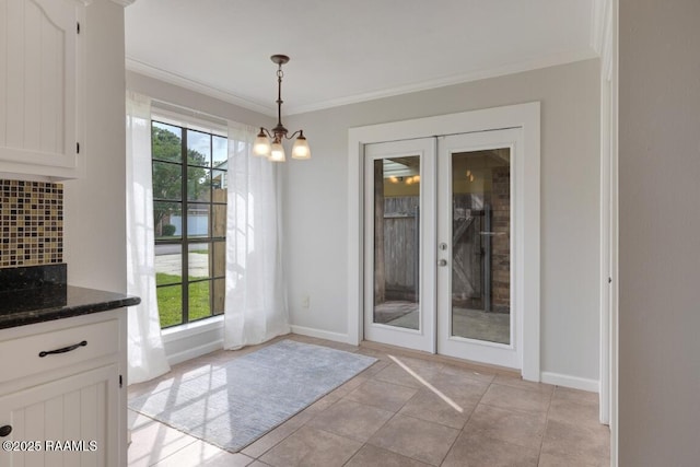 204 Eva Dr, Lafayette, LA 70508 - entryway featuring crown molding, a notable chandelier, baseboards, and french doors