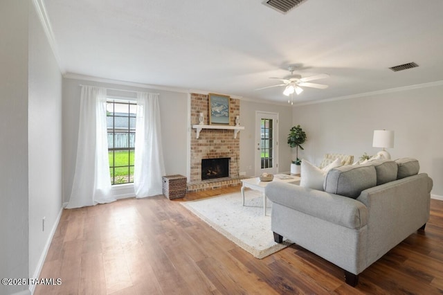 204 Eva Dr, Lafayette, LA 70508 - living room featuring a ceiling fan, crown molding, visible vents, and wood finished floors