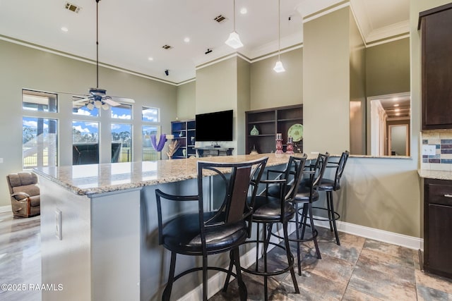1319 W Gloria Switch Rd, Carencro, LA 70520 - kitchen featuring ceiling fan, visible vents, baseboards, and ornamental molding