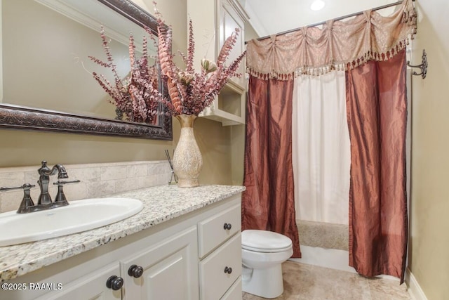 full bathroom featuring toilet, tile patterned floors, vanity, and shower / bath combination with curtain