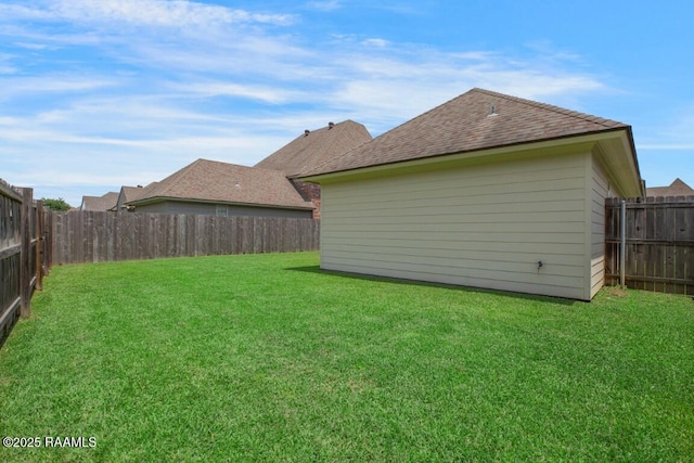 view of yard with a fenced backyard
