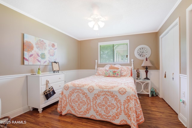 bedroom featuring ornamental molding and dark wood-type flooring