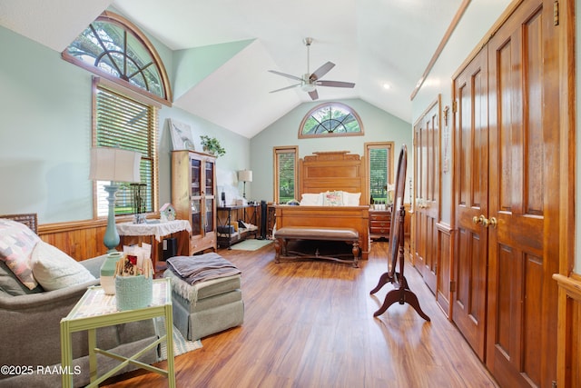 bedroom featuring lofted ceiling and wood finished floors