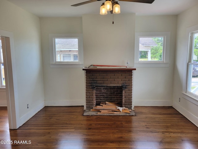 unfurnished living room featuring ceiling fan, wood finished floors, and a healthy amount of sunlight