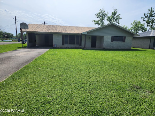 1014 Amy St, Breaux Bridge, LA 70517 - ranch-style house featuring aphalt driveway, a front lawn, and an attached carport