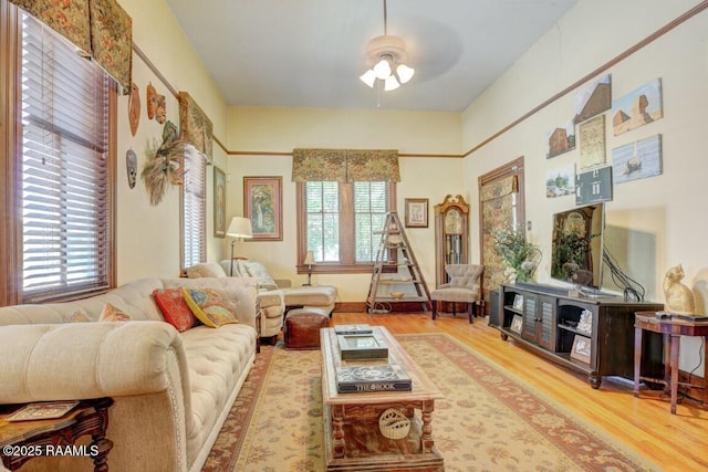 122 Lee St, New Iberia, LA 70560 - living area featuring ceiling fan and wood finished floors