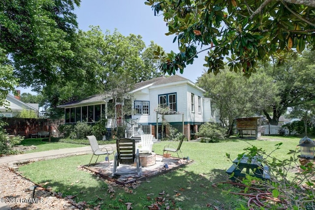 122 Lee St, New Iberia, LA 70560 - back of house featuring an outdoor fire pit, a patio, stairs, and a sunroom
