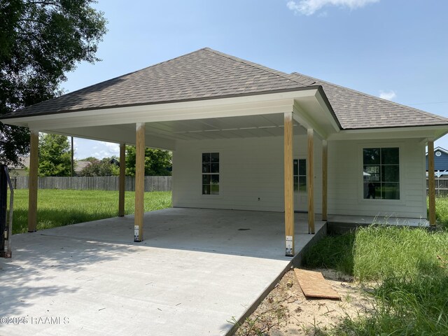 203 Deerfield Loop, Duson, LA 70529 - view of patio with driveway and a carport