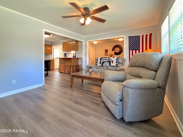 230 Glenwood Ave, Morgan City, LA 70380 - living area featuring ceiling fan, light wood-style flooring, and baseboards