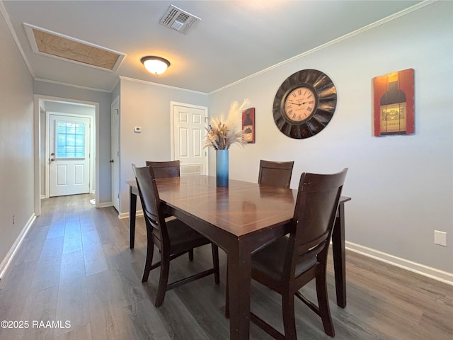 230 Glenwood Ave, Morgan City, LA 70380 - dining area featuring wood finished floors, baseboards, and ornamental molding