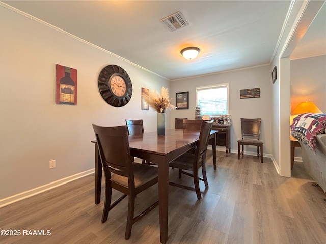 230 Glenwood Ave, Morgan City, LA 70380 - dining space with ornamental molding, wood finished floors, and baseboards