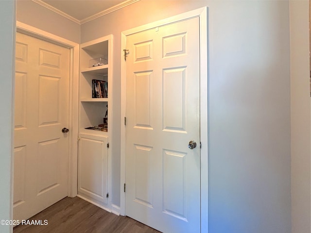 230 Glenwood Ave, Morgan City, LA 70380 - corridor with built in shelves, crown molding, and dark wood-style flooring