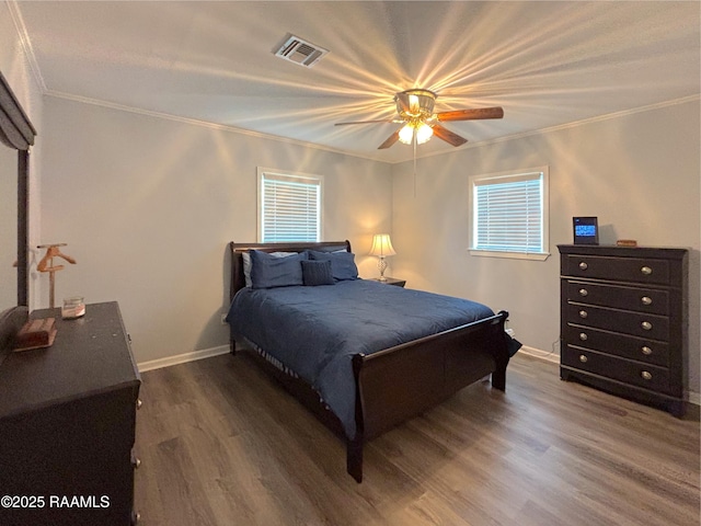 230 Glenwood Ave, Morgan City, LA 70380 - bedroom with crown molding, multiple windows, wood finished floors, baseboards, and a ceiling fan