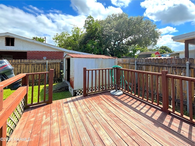 230 Glenwood Ave, Morgan City, LA 70380 - wooden deck with a storage unit, a fenced backyard, and an outdoor structure