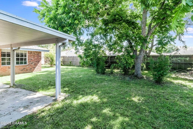 view of yard with a fenced backyard