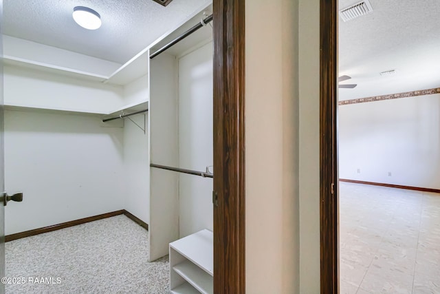 walk in closet with visible vents