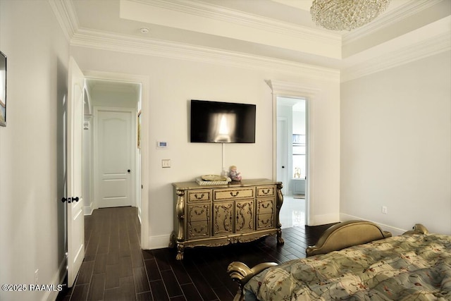 living room featuring a tray ceiling, dark wood-style floors, baseboards, and crown molding