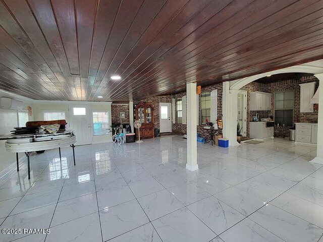 misc room featuring wood ceiling and light marble finish floors