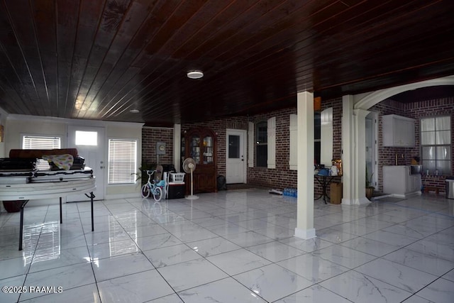 4300 Gerald James Dr, New Iberia, LA 70560 - misc room with brick wall, wood ceiling, and marble finish floors