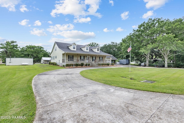 16634 W La Highway 330, Abbeville, LA 70510 - view of front of house with curved driveway, covered porch, and a front yard