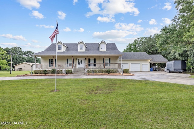 16634 W La Highway 330, Abbeville, LA 70510 - view of front of house with driveway, covered porch, a front yard, and a garage