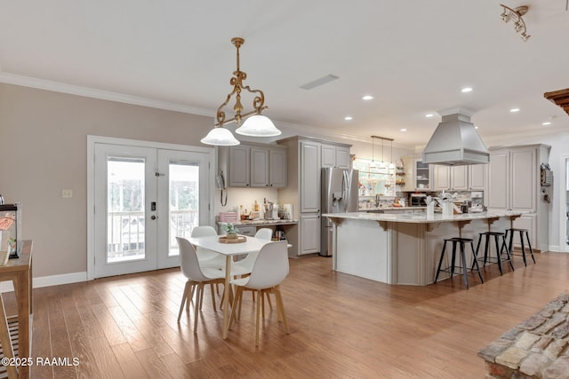 16634 W La Highway 330, Abbeville, LA 70510 - dining area with light wood-type flooring, ornamental molding, baseboards, and recessed lighting