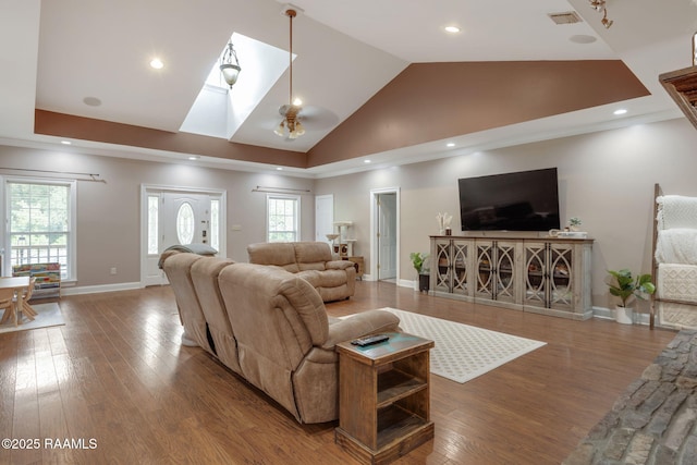 16634 W La Highway 330, Abbeville, LA 70510 - living area with wood finished floors, healthy amount of natural light, a skylight, baseboards, and recessed lighting