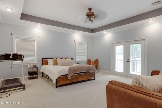 16634 W La Highway 330, Abbeville, LA 70510 - carpeted bedroom featuring access to exterior, crown molding, french doors, baseboards, and a tray ceiling