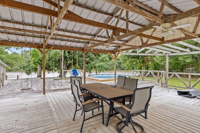 16634 W La Highway 330, Abbeville, LA 70510 - wooden deck with ceiling fan, an outdoor pool, and outdoor dining area