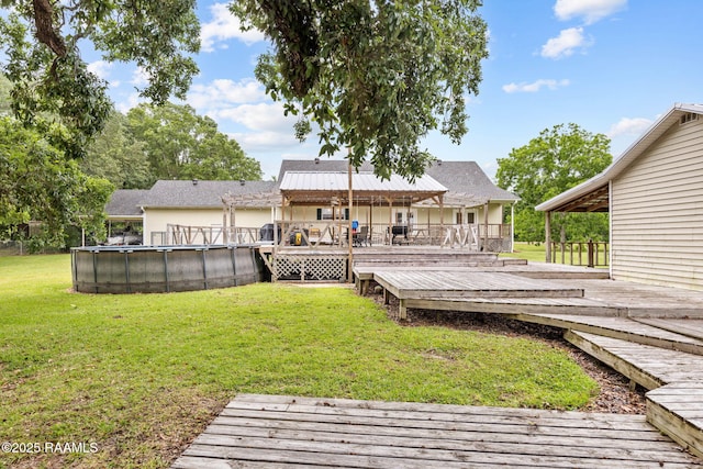 16634 W La Highway 330, Abbeville, LA 70510 - wooden deck with an outdoor pool and a lawn