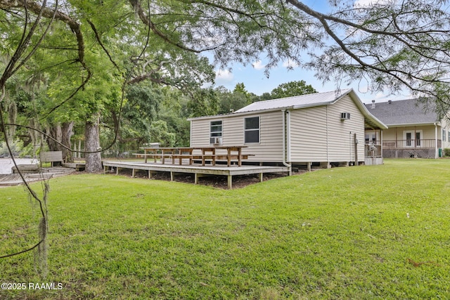 16634 W La Highway 330, Abbeville, LA 70510 - back of house featuring a deck, a yard, and metal roof