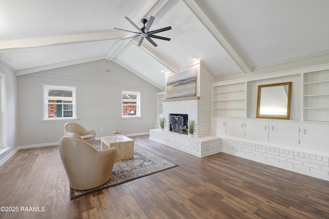 513 Emmeline St, New Iberia, LA 70563 - living room featuring ceiling fan, wood finished floors, a brick fireplace, and baseboards