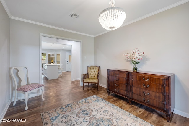 513 Emmeline St, New Iberia, LA 70563 - living area with a chandelier, baseboards, wood finished floors, and ornamental molding