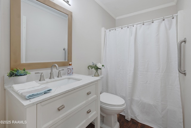 513 Emmeline St, New Iberia, LA 70563 - bathroom with crown molding, wood finished floors, toilet, vanity, and a shower with shower curtain