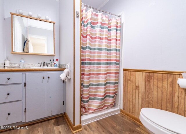 2405 S Chataignier Rd, Ville Platte, LA 70586 - bathroom featuring wood finished floors, curtained shower, vanity, and toilet