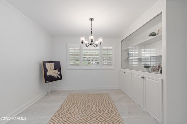 unfurnished dining area with a chandelier and ornamental molding