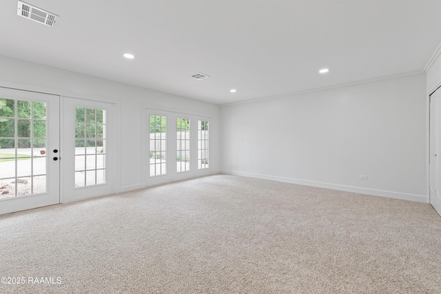 unfurnished room with french doors, carpet, recessed lighting, and baseboards