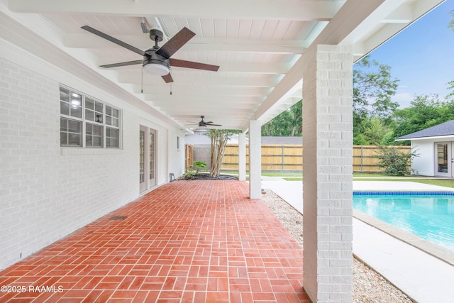 view of patio with a fenced backyard, ceiling fan, and french doors