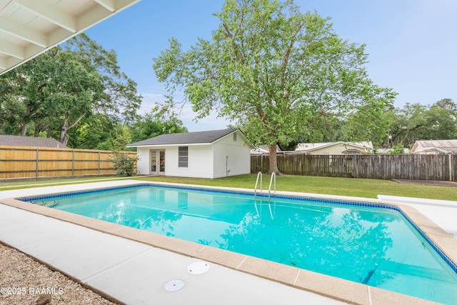 view of pool with french doors and an outdoor structure