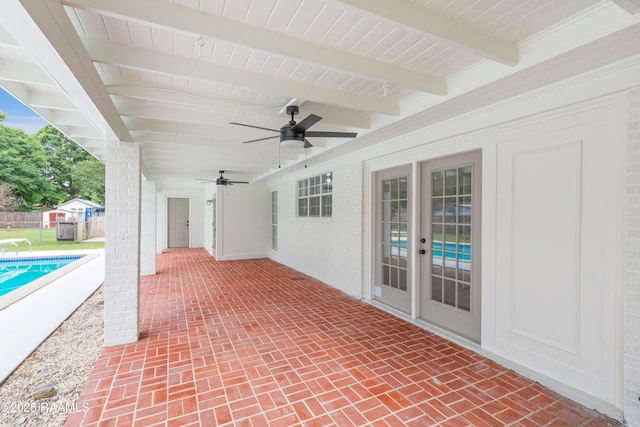 view of patio featuring a ceiling fan and fence