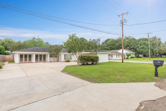 single story home with french doors and concrete driveway