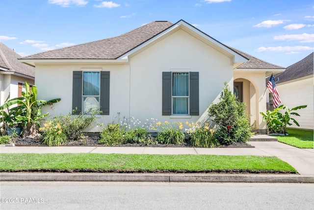 123 Laurel Grove Blvd, Youngsville, LA 70592 - view of front of house featuring a shingled roof and stucco siding