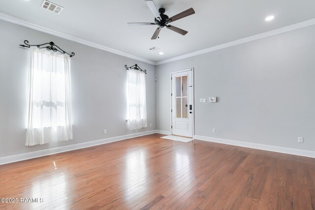 123 Laurel Grove Blvd, Youngsville, LA 70592 - empty room featuring wood finished floors, ornamental molding, a ceiling fan, baseboards, and recessed lighting
