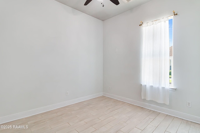 123 Laurel Grove Blvd, Youngsville, LA 70592 - empty room featuring ceiling fan, baseboards, healthy amount of natural light, and light wood-style flooring