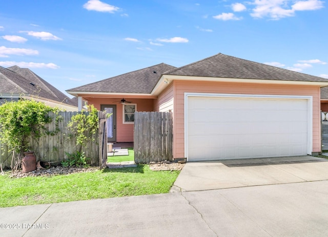 123 Laurel Grove Blvd, Youngsville, LA 70592 - view of front of home featuring roof with shingles, concrete driveway, and a garage