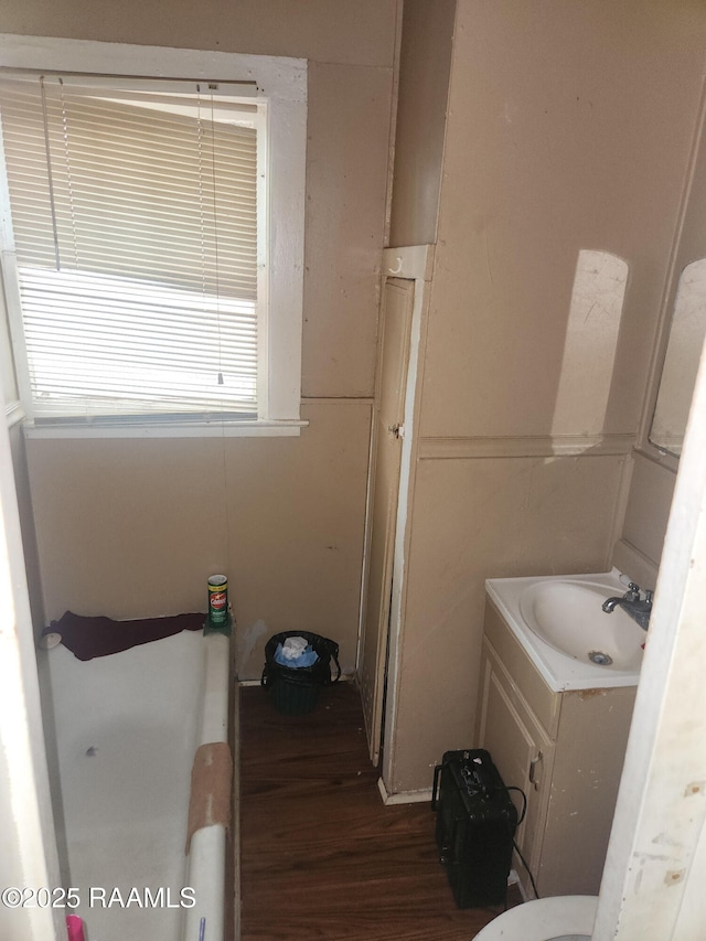 713 E Vermilion St, Lafayette, LA 70501 - bathroom with wood finished floors and vanity