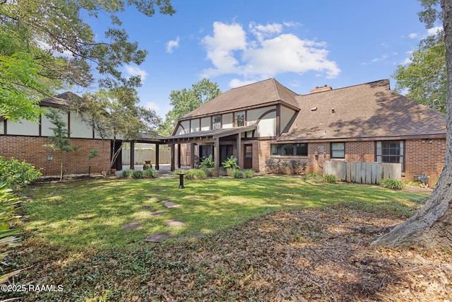 207 Beverly Dr, Lafayette, LA 70503 - rear view of house featuring brick siding and a shingled roof